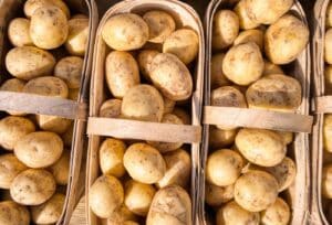 clean potatoes that are neatly packaged in a woven basket