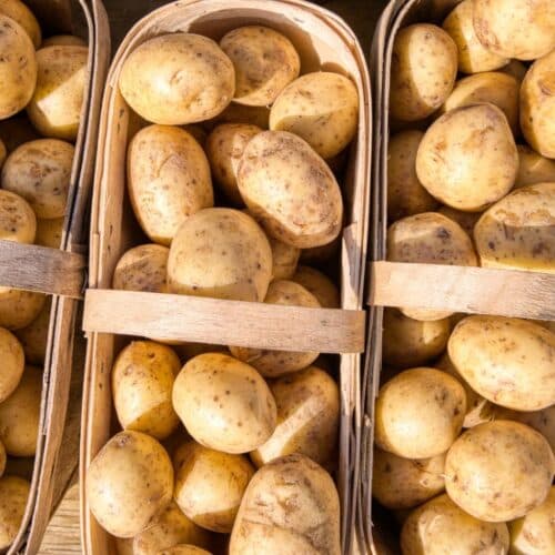 clean potatoes that are neatly packaged in a woven basket